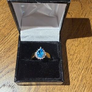 Blue Teardrop Topaz Halo Ring in 14k Gold